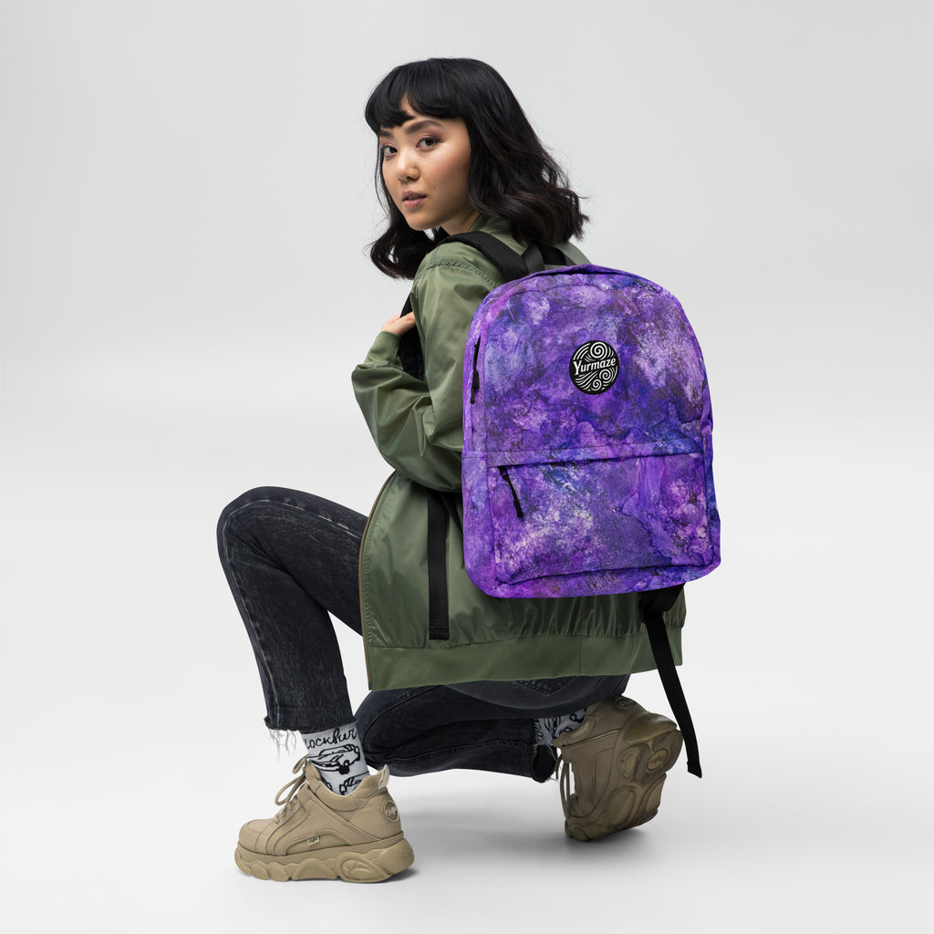 Woman modelling a Yurmaze Purple Infusion medium backpack with abstract alcohol ink artwork