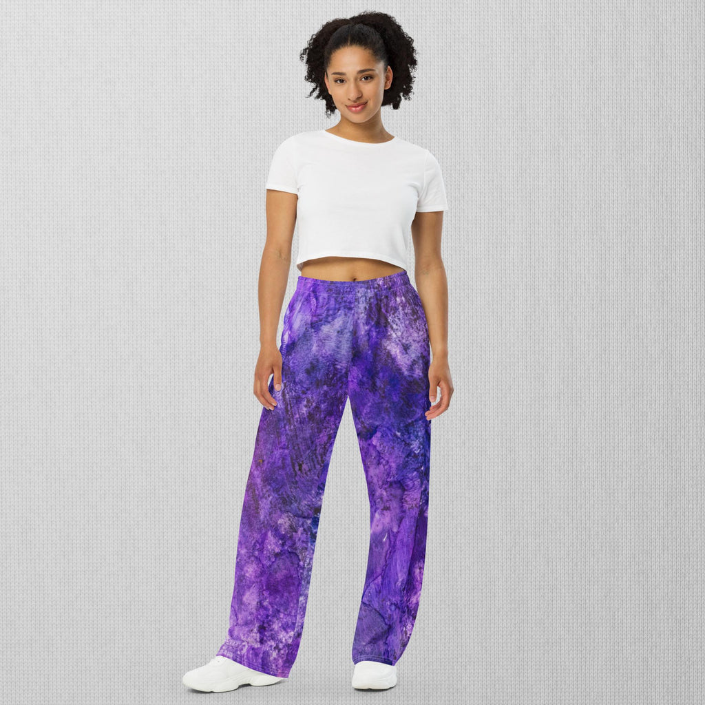 Photo from the front - Unisex wide-leg pants with abstract purple alcohol ink print by Yurmaze