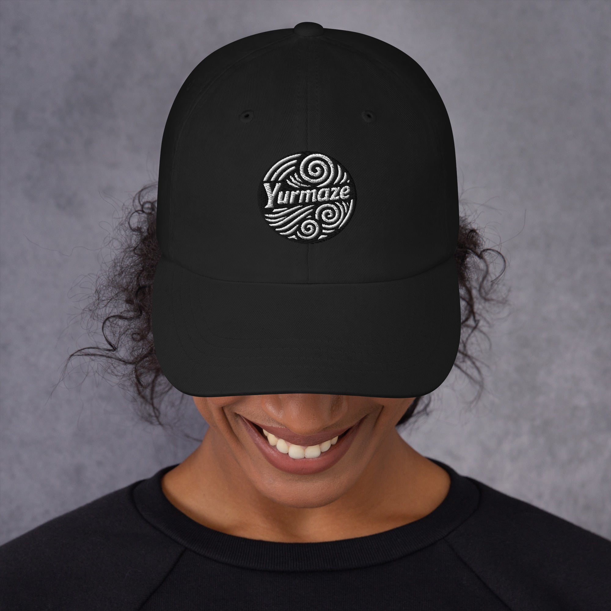 Head down in a Yurmaze Dad Hat with original spiral artwork, low-profile 6-panel design, adjustable strap with antique buckle – wearable art among creative hats.