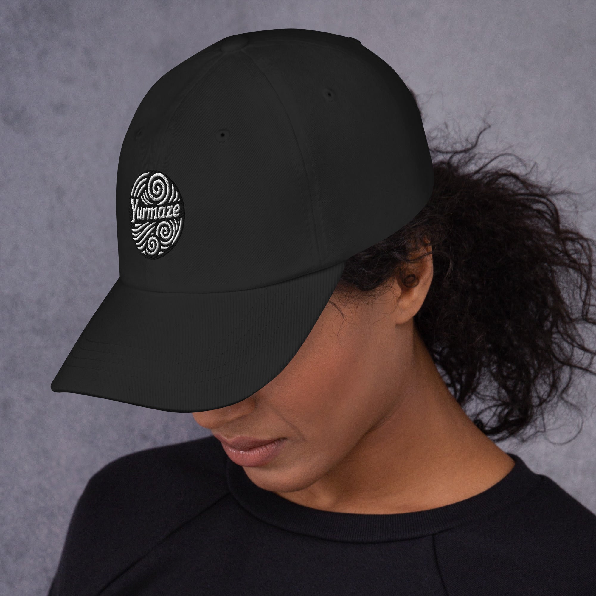 Head down to the side of a Yurmaze Dad Hat with original spiral artwork, low-profile 6-panel design, adjustable strap with antique buckle – wearable art among creative hats.