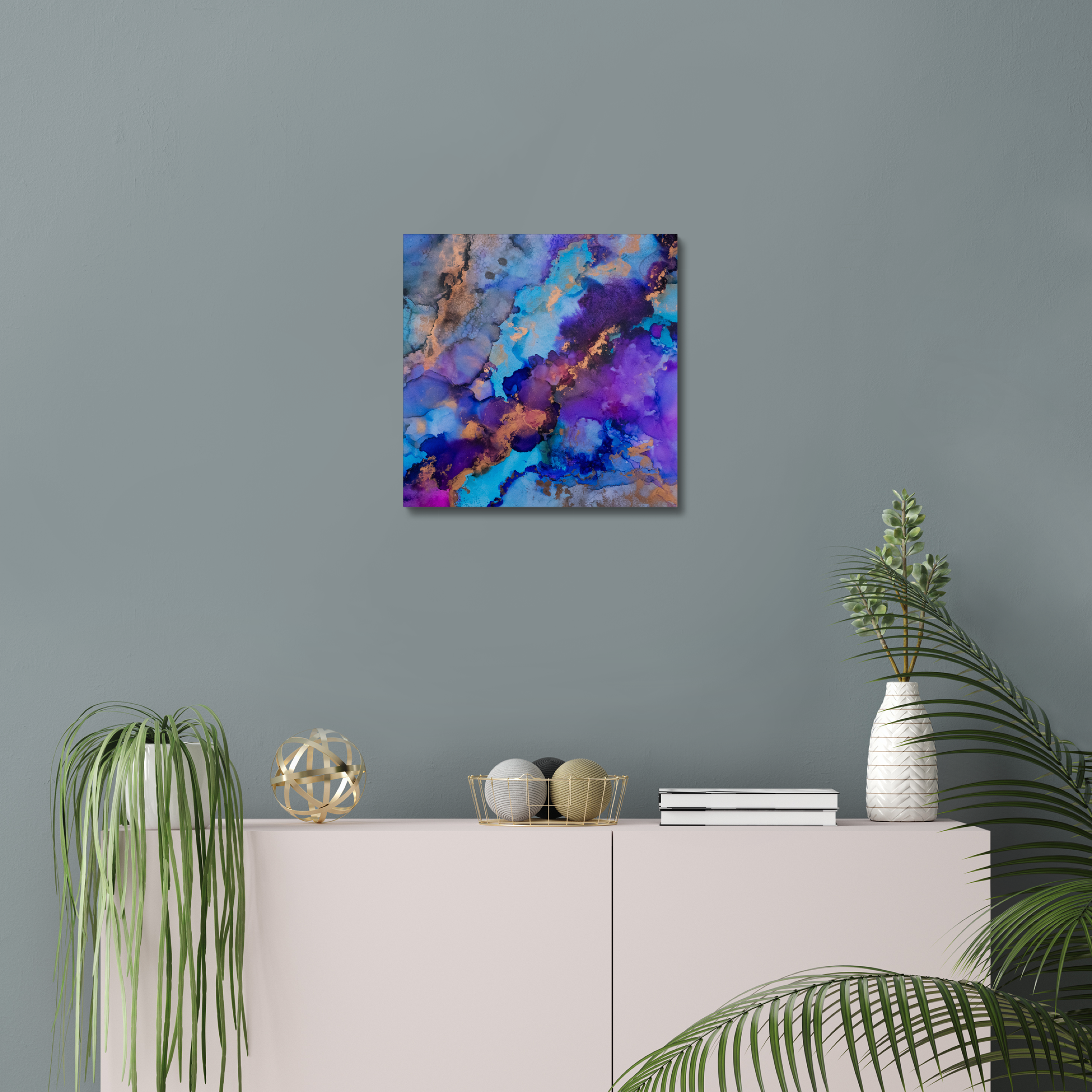 Abstract canvas print featuring alcohol ink design by Yurmaze in blue, purple, and gold tones, displayed as modern wall art in a minimal interior.