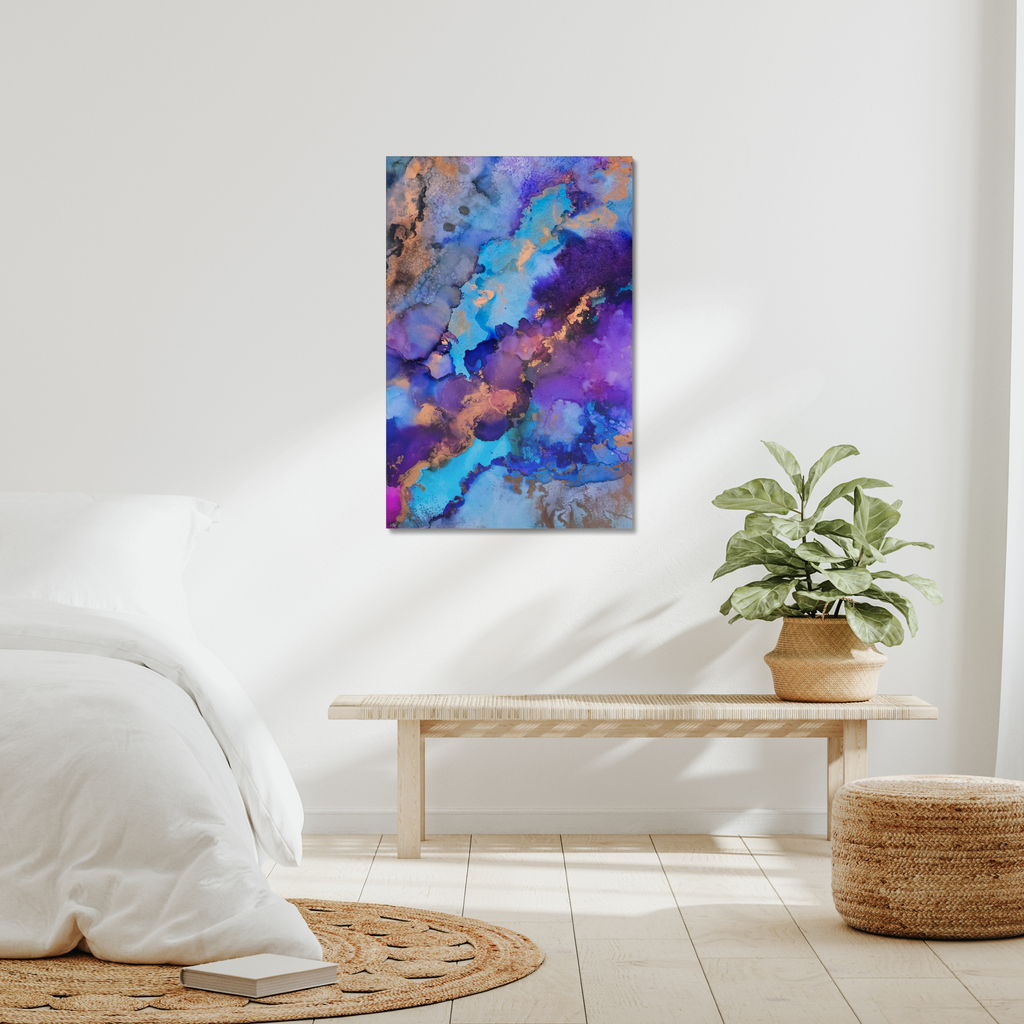Abstract canvas print featuring alcohol ink design by Yurmaze in blue, purple, and gold tones, displayed as modern wall art in a minimal interior.