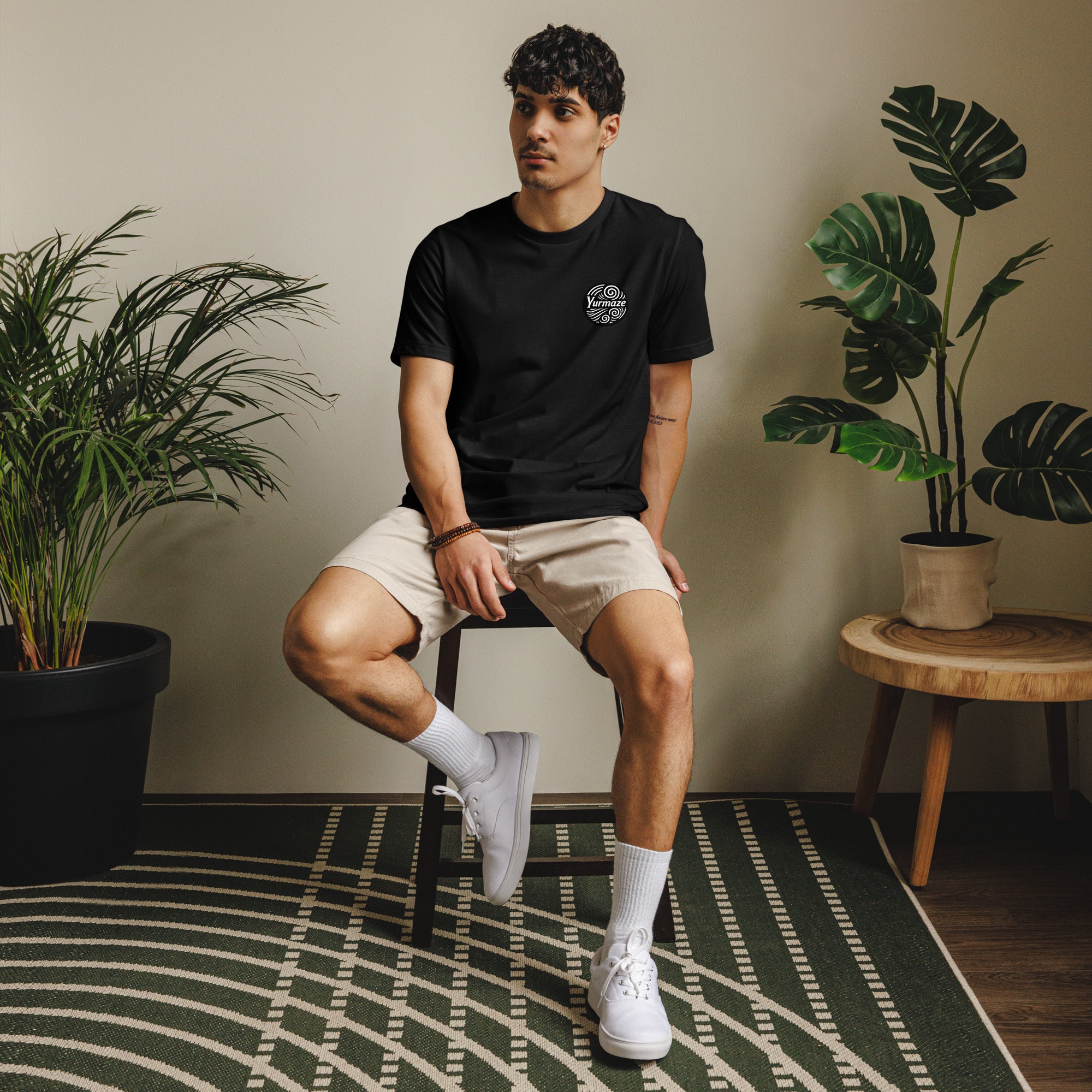 Lifestyle image of the front view of a yurmaze eco-friendly unisex t-shirt made from recycled materials